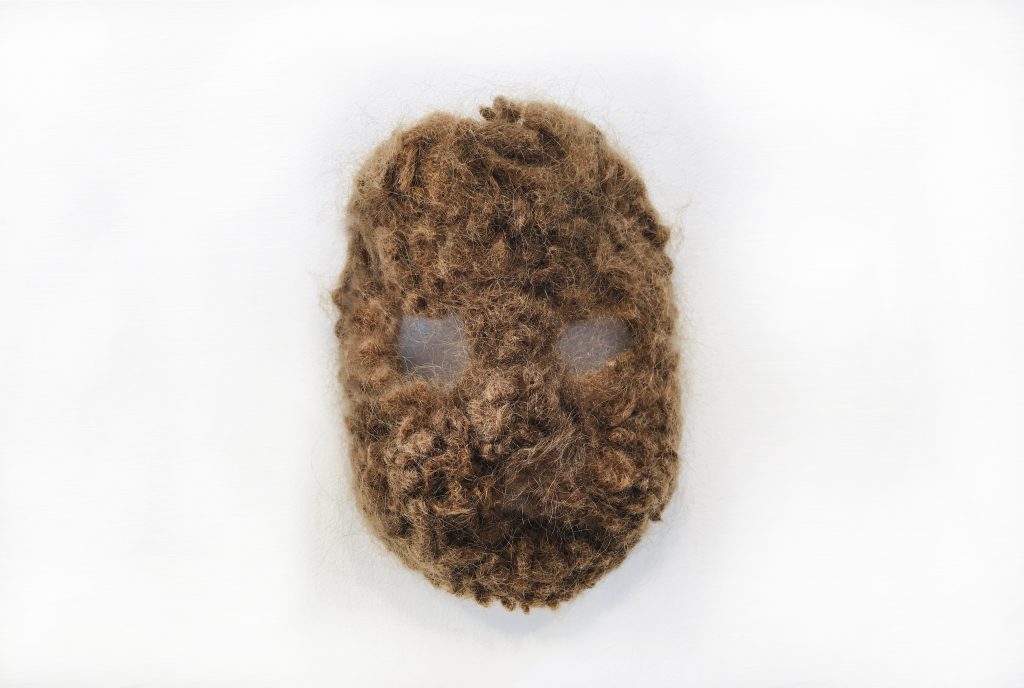 Carollyne Yardley, Human Hair Squirrel Mask, from the Becoming Plastic series, 2022. Human hair, 2012-2018, 8” 10” x 4”nstallation view from Becoming Plastic at Deluge Contemporary Art, 2022. Photograph by Carollyne Yardley.